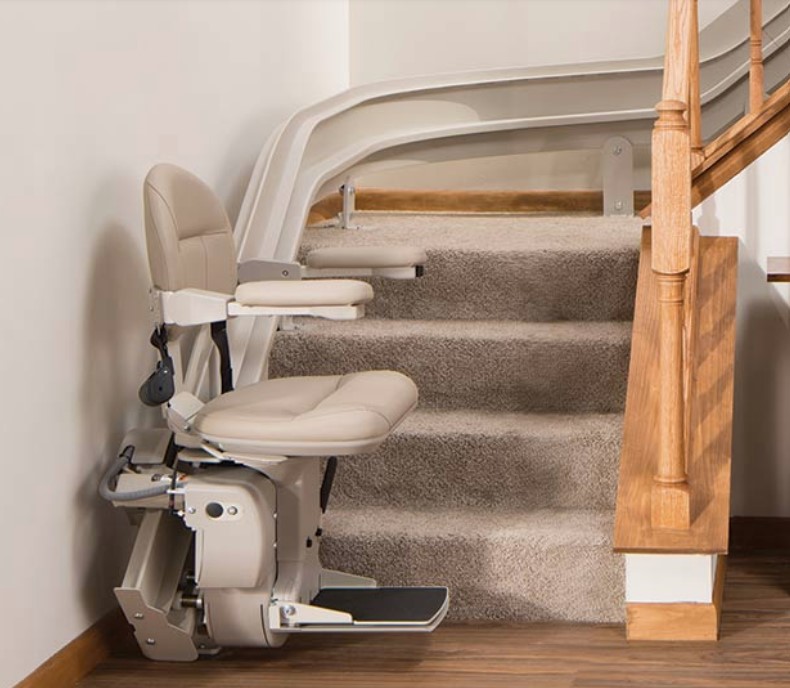 Real Bruno Elite curved indoor stair lift following a wooden staircase